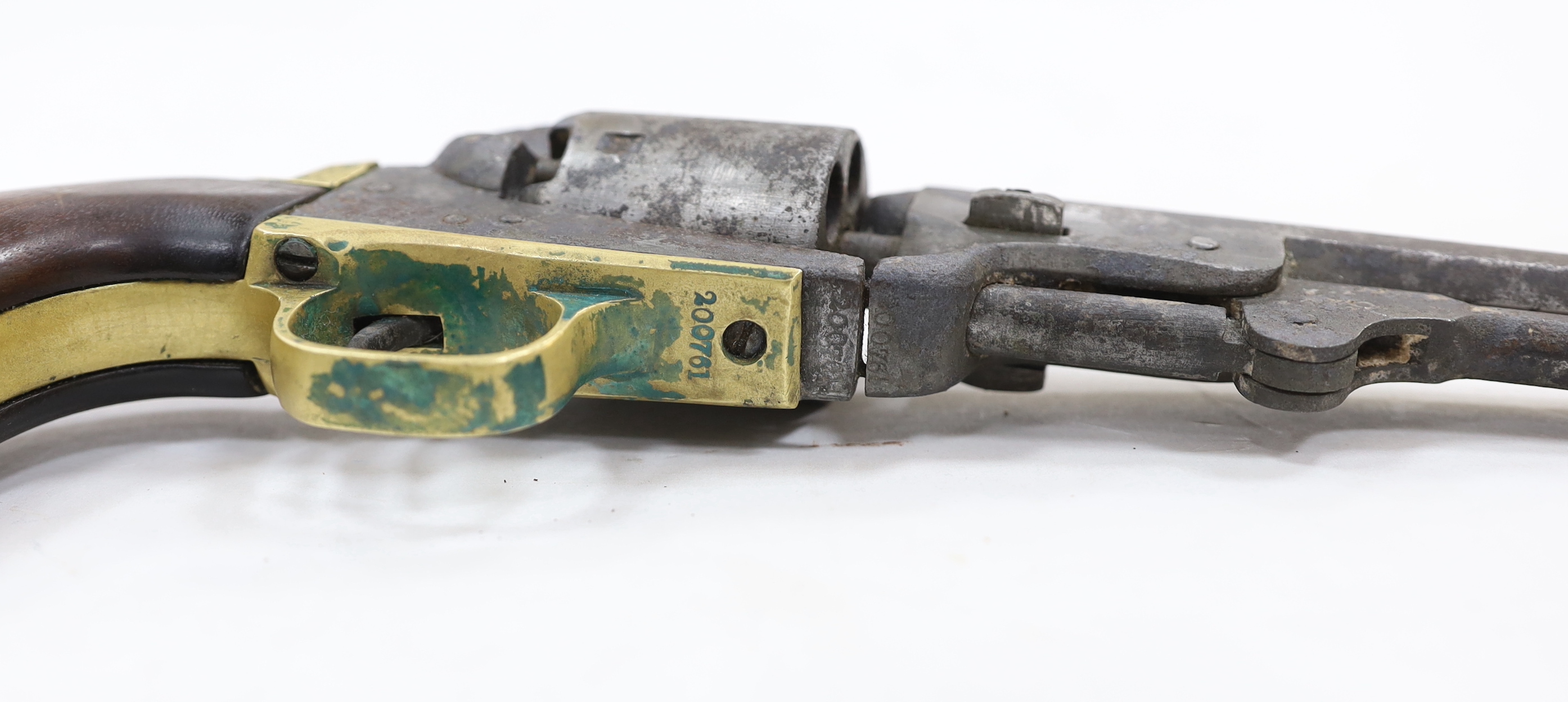A six shot .36” Colt Navy percussion revolver number 200761 (matching) regulation underlever rammer, brass grip strap and trigger guard, pitted and worn overall